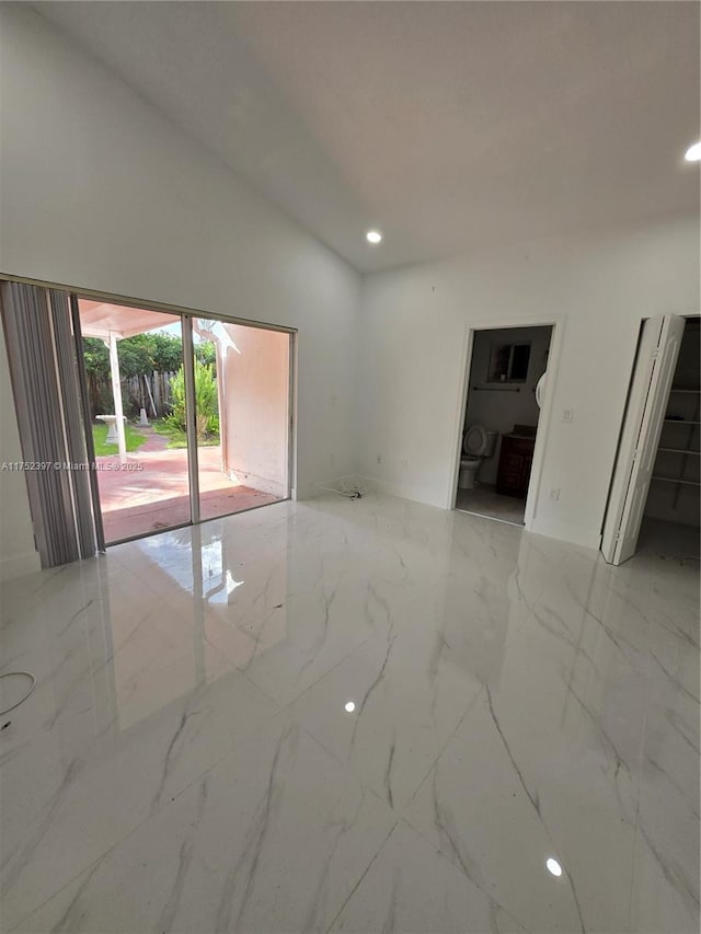 empty room with marble finish floor and recessed lighting