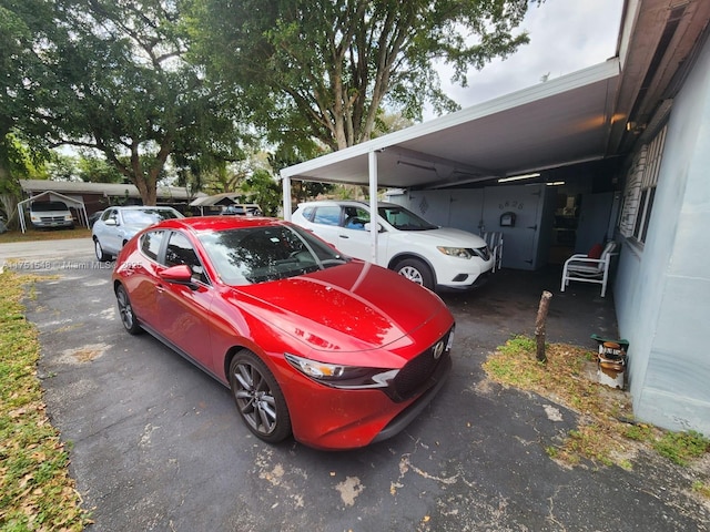 6825 SW 12th St, Pembroke Pines, FL 33023 - view of vehicle parking with a carport