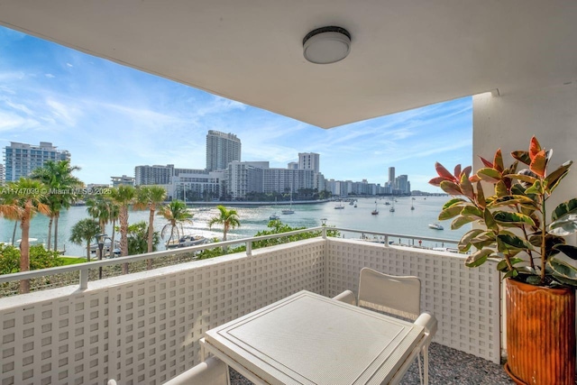 balcony with a view of city and a water view