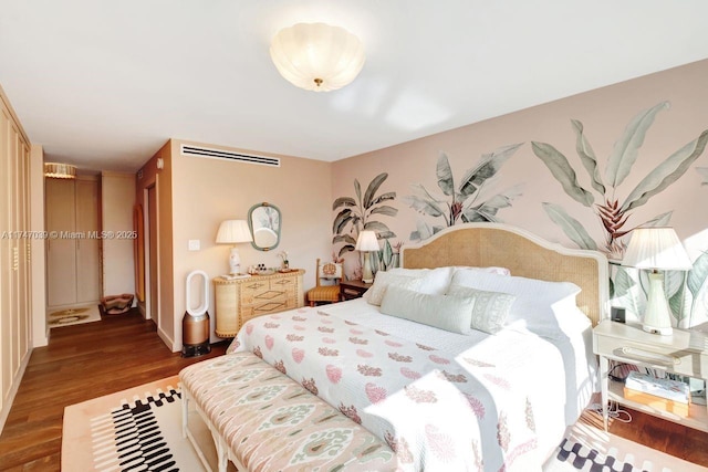 bedroom featuring wood finished floors