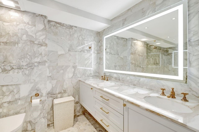 full bathroom featuring visible vents, a sink, tile walls, and toilet