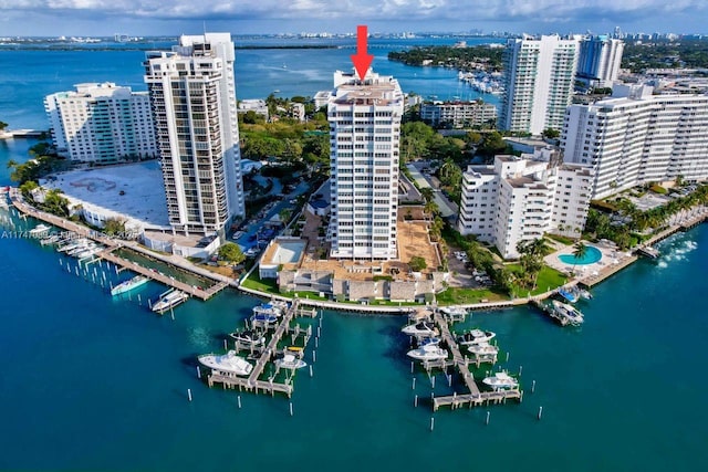 aerial view featuring a view of city and a water view