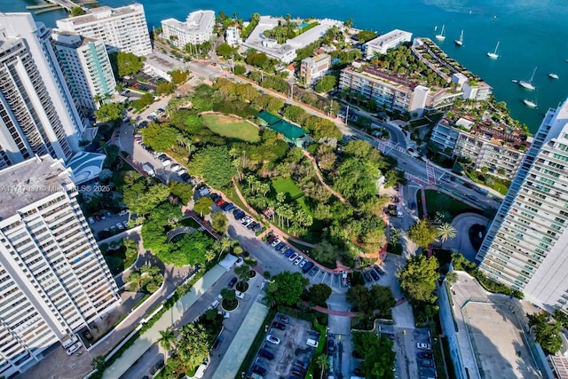 birds eye view of property featuring a water view and a view of city