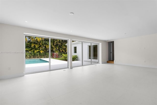 unfurnished room featuring recessed lighting