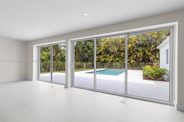 doorway to outside featuring recessed lighting