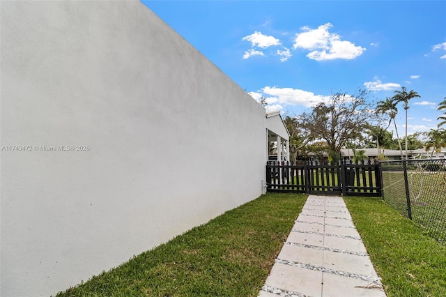 view of yard featuring a gate and fence