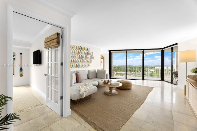 living room featuring ornamental molding, a wall of windows, light tile patterned flooring, and baseboards