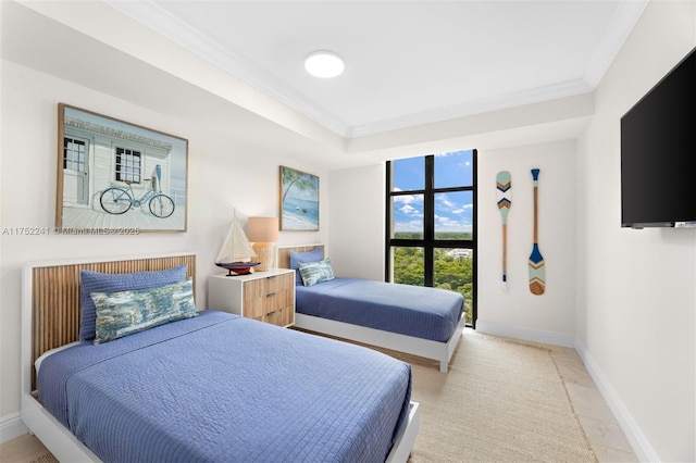 bedroom featuring baseboards and crown molding