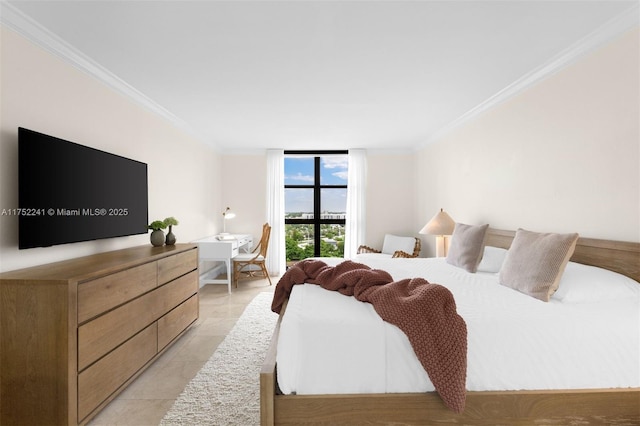 bedroom with light tile patterned floors, ornamental molding, and a wall of windows