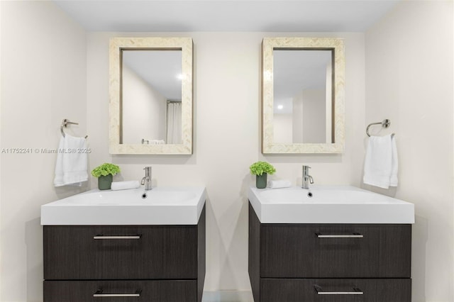 full bathroom with two vanities and a sink