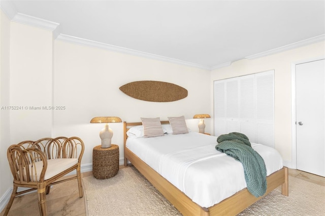 bedroom with ornamental molding, tile patterned flooring, and baseboards