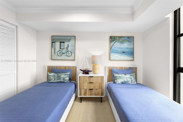 bedroom with carpet floors and crown molding