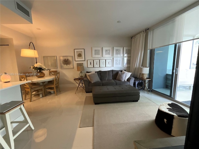 living room with visible vents and baseboards