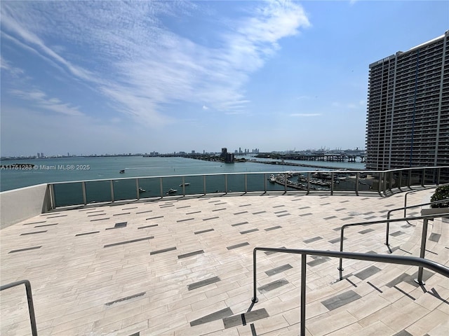 view of patio featuring a water view