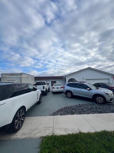 view of car parking with driveway