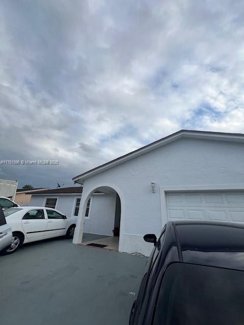 view of front of house featuring stucco siding