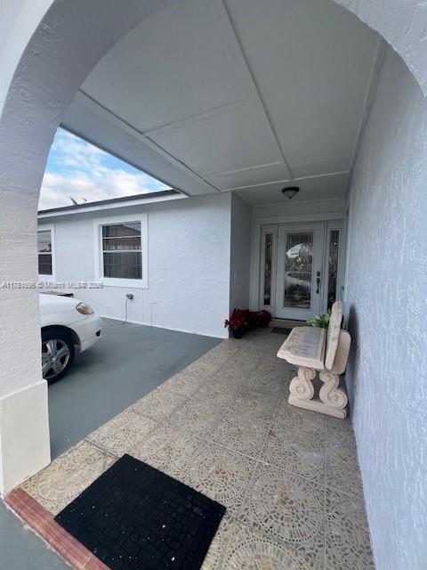 exterior space featuring stucco siding