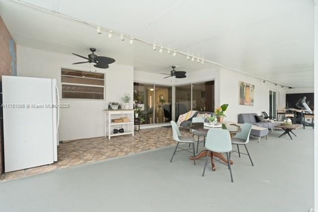 view of patio / terrace featuring outdoor dining space and a ceiling fan