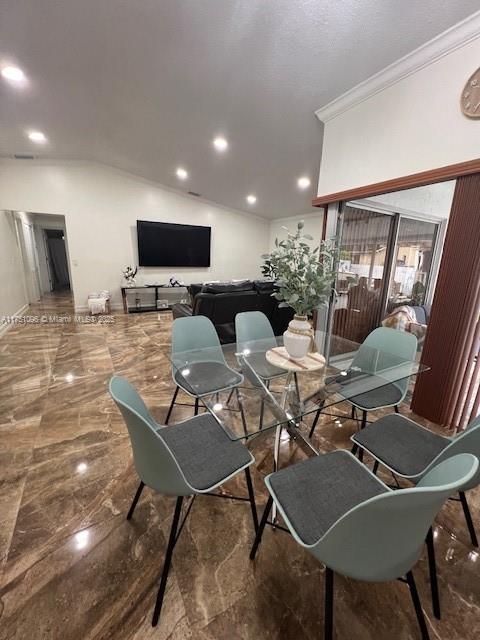 interior space featuring marble finish floor, ornamental molding, vaulted ceiling, and recessed lighting