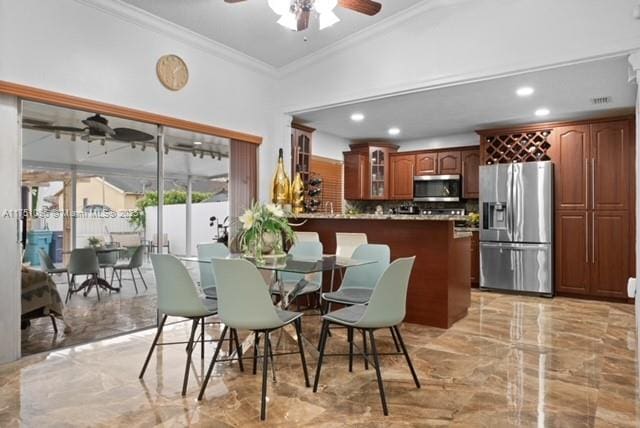 dining area featuring recessed lighting, marble finish floor, ornamental molding, and ceiling fan