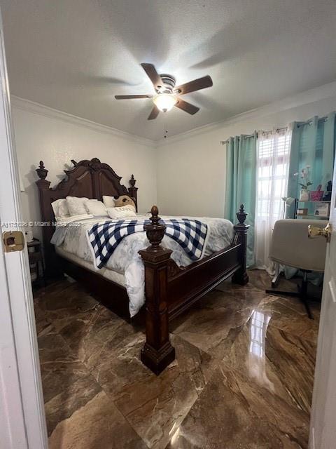 bedroom with ornamental molding, marble finish floor, and a ceiling fan