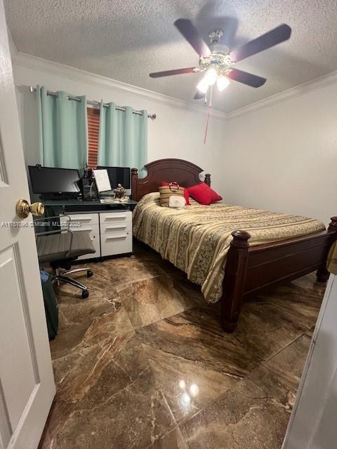 bedroom with marble finish floor, ceiling fan, ornamental molding, and a textured ceiling