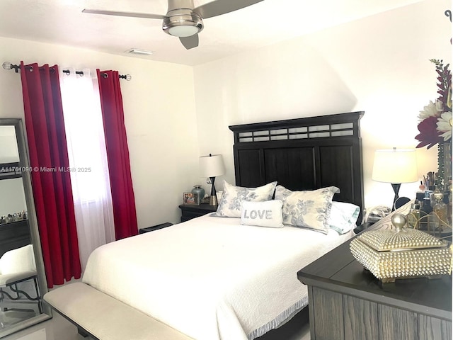 bedroom with ceiling fan and visible vents