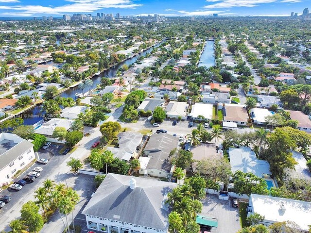 birds eye view of property with a view of city, a water view, and a residential view