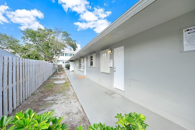 view of home's exterior featuring fence and stucco siding