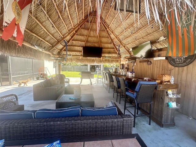 view of patio / terrace featuring an outdoor hangout area, outdoor dry bar, and a gazebo