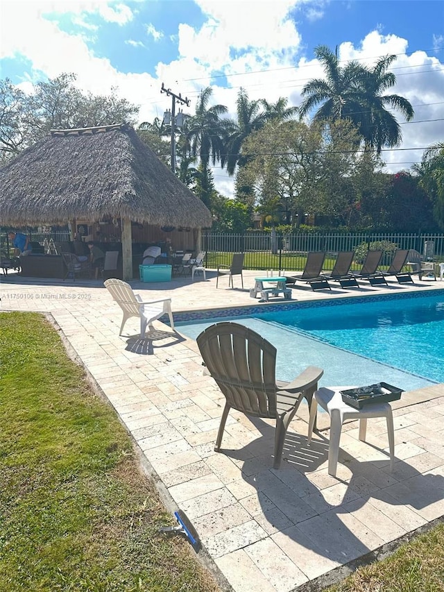 view of pool featuring a fenced in pool, fence, a gazebo, and a patio