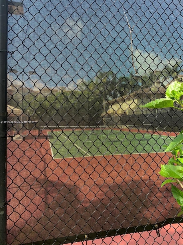 view of sport court with fence