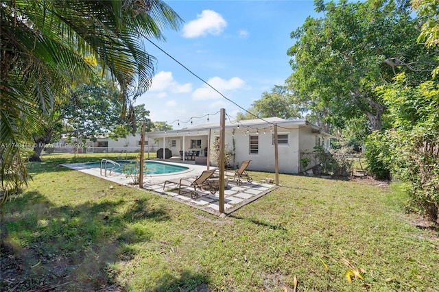 940 SW 52nd Ave, Plantation, FL 33317 - back of house featuring a fenced backyard, a patio, and stucco siding