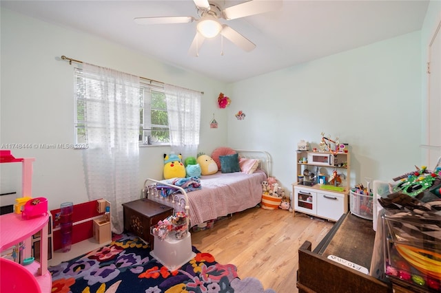 bedroom featuring ceiling fan and wood finished floors