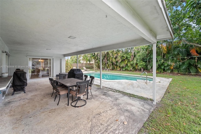 view of pool with a patio, area for grilling, a fenced backyard, and a fenced in pool