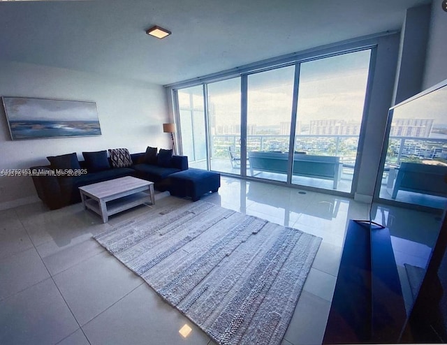 living area featuring a view of city, expansive windows, a wealth of natural light, and tile patterned floors