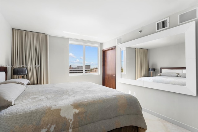 bedroom featuring visible vents and baseboards