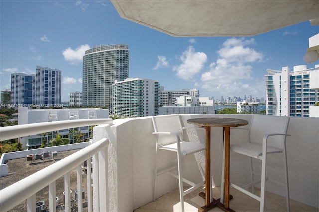 balcony featuring a view of city