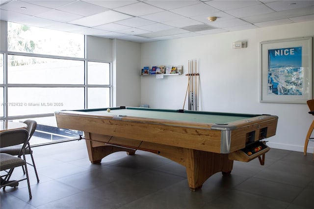 recreation room featuring billiards, a paneled ceiling, and baseboards