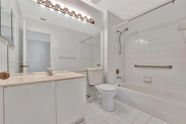 bathroom with visible vents, toilet, tile patterned flooring, vanity, and shower / washtub combination