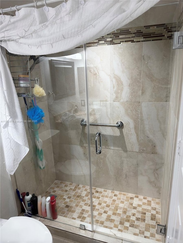 full bathroom with a shower stall