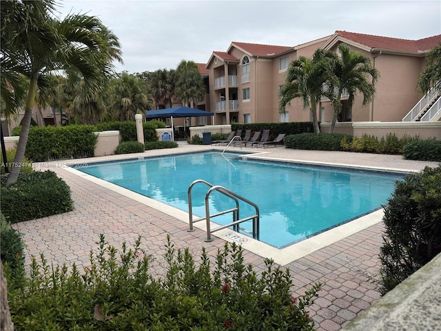 community pool featuring a patio area