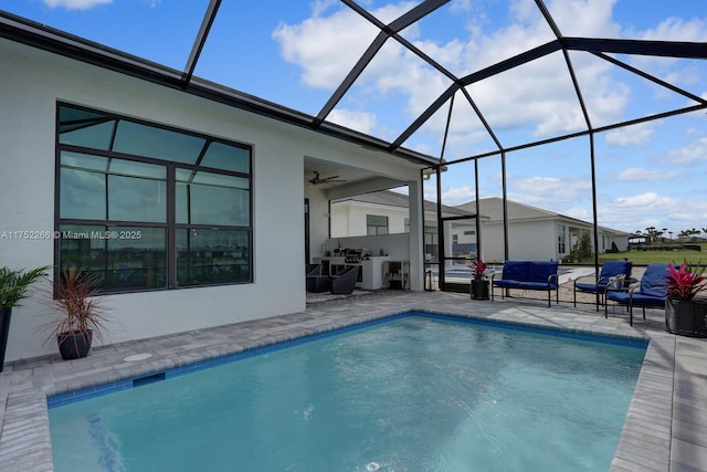 pool with a ceiling fan, a lanai, a patio, and an outdoor living space