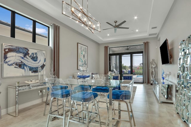 dining room featuring a tray ceiling, recessed lighting, visible vents, a ceiling fan, and baseboards