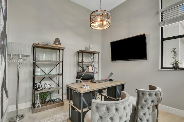 tiled office space featuring baseboards