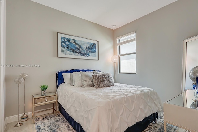 bedroom featuring baseboards