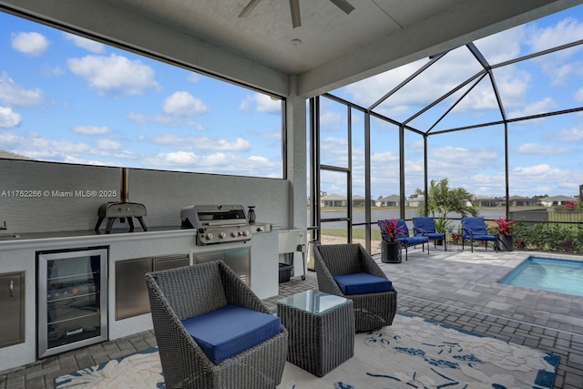 view of patio / terrace with area for grilling, glass enclosure, wine cooler, grilling area, and outdoor lounge area