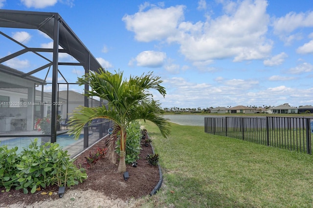 view of yard featuring glass enclosure and fence