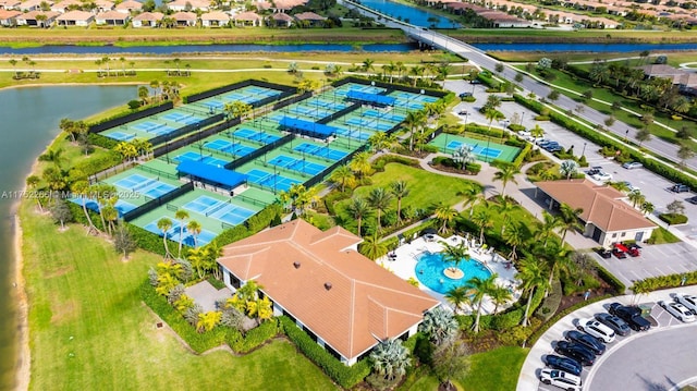 birds eye view of property with a water view and a residential view