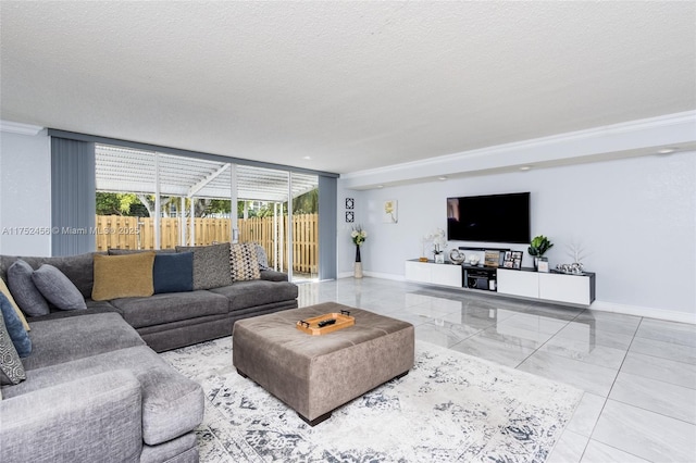 living room featuring floor to ceiling windows, baseboards, and a textured ceiling